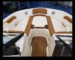 Interior view of the front sitting area on a Bayliner boat
