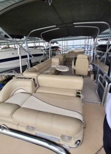 Rear to front view of boat, sitting areas and a canopy top