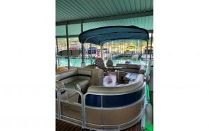 Covered boat with round sitting area in front