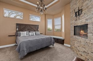 Interior rental house bedroom with fireplace