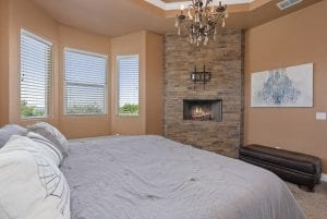 rental house bedroom with a fireplace