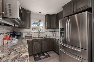 Rental house kitchen, granite & tile backsplash